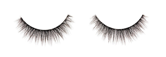 A single pair of Ardell Faux Mink 815 featuring its short length and round shaping