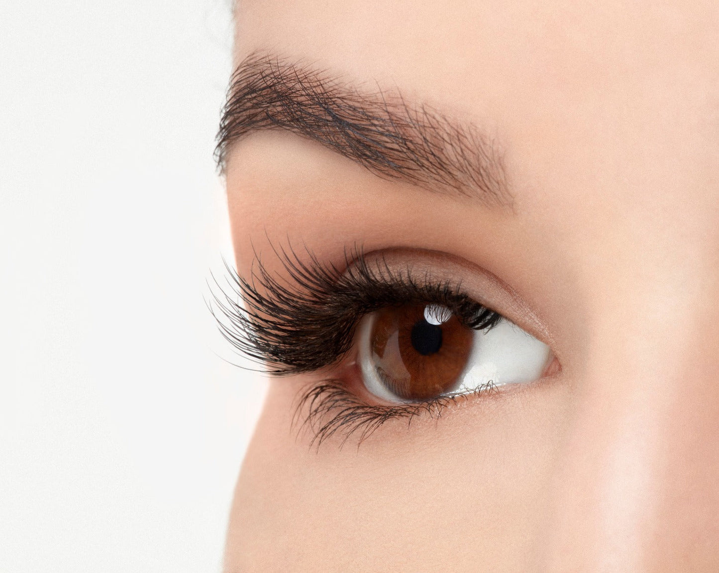 Angled right eye of a model wearing Ardell Pre-Cut Lashes 900 showing its curly & flares faux lash