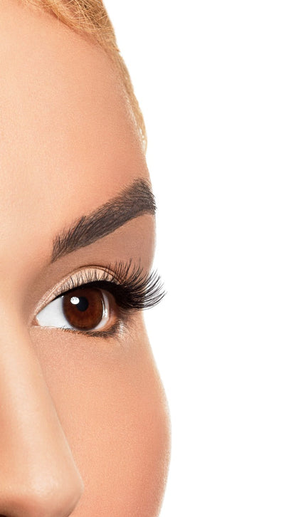 Model shot of eye to angle wearing Winks Half & Half Pre-Cut Lashes Dream