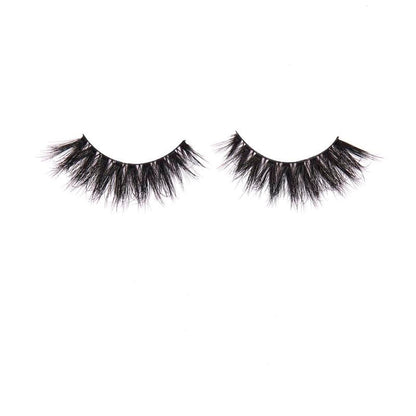 Pair of black false eyelashes on a white background